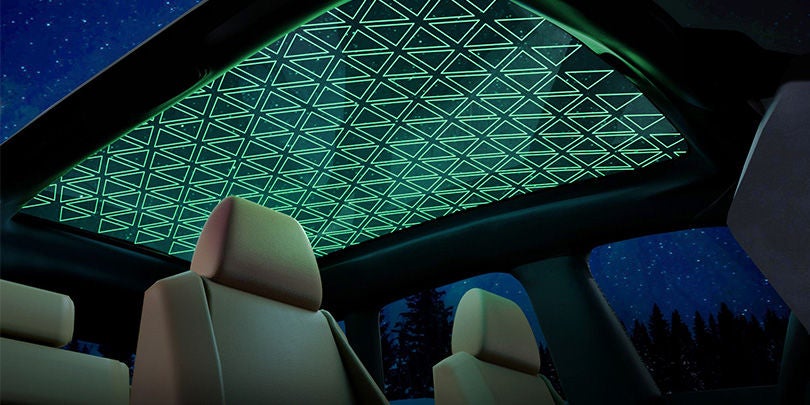 A large fices panoramic roof with integrated ambient light and segmented switchable glazing technologies
