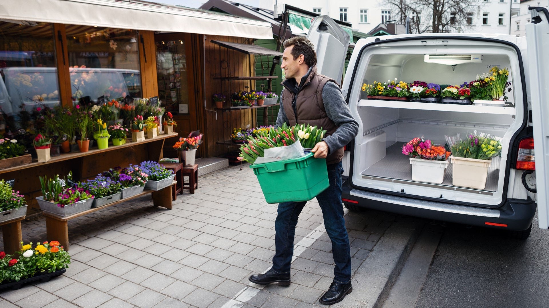 Man getting flowers from his light duty vehicle with transport refrigeration