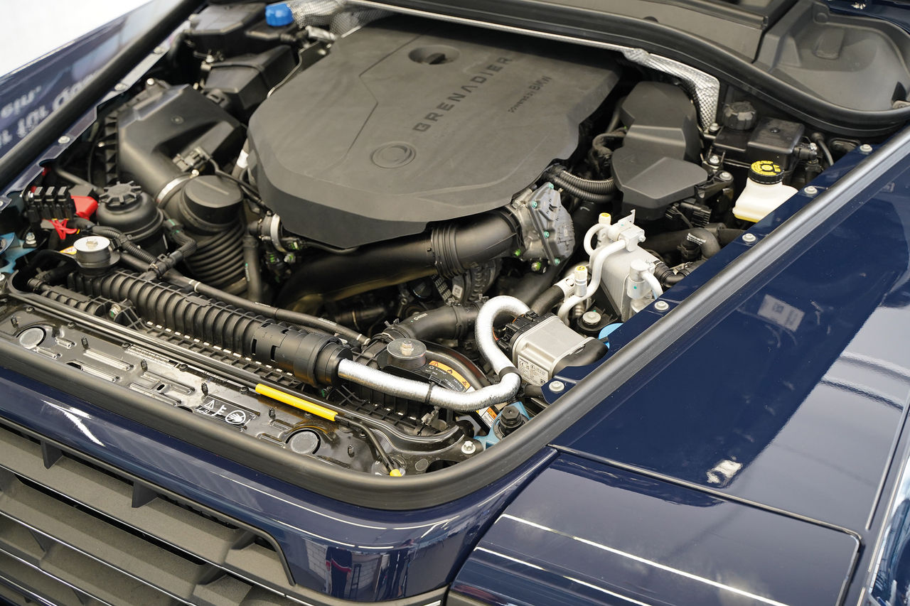 Ineos Grenadier engine bay close-up showcasing Webasto-integrated thermal management, coolant and HVAC routing for vehicle solutions on off-road platforms.