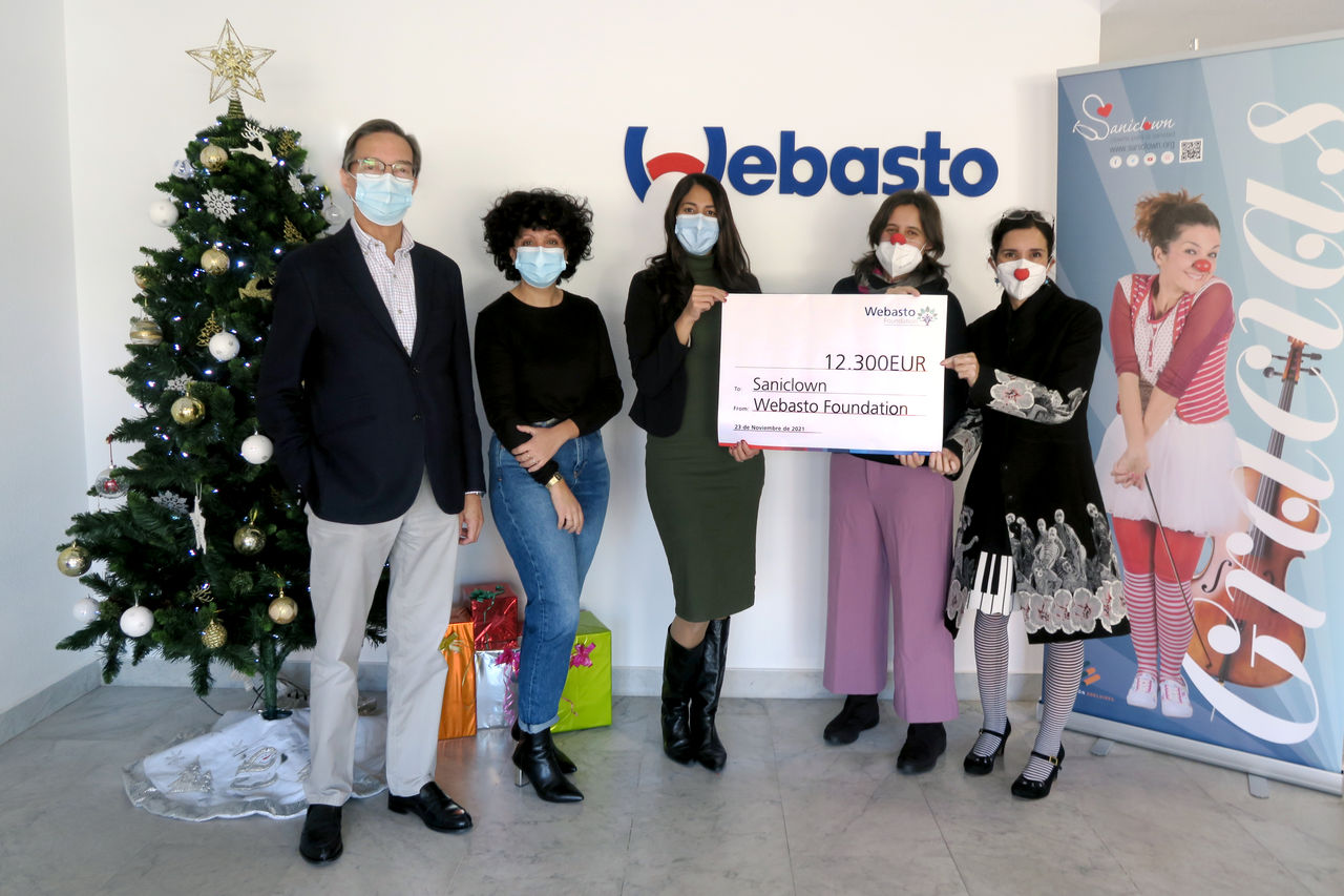 Webasto Foundation donates €12,300 to Sanicdown during a holiday handover at Webasto office, highlighting Webasto’s commitment as a global systems partner.