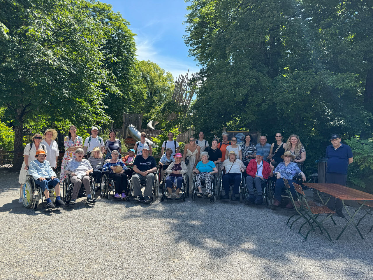 Webasto Foundation community outing featuring wheelchair users and caregivers, illustrating company-supported social engagement and inclusion initiatives.