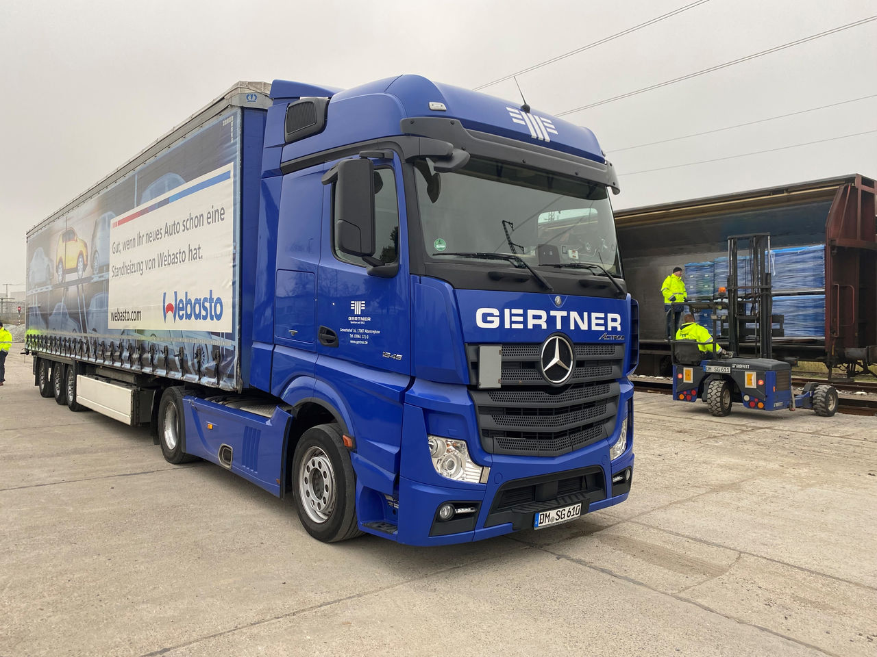 Curtainside truck with Webasto branding promoting heating systems; header for vehicle solutions and logistics, reinforcing Webasto as system partner