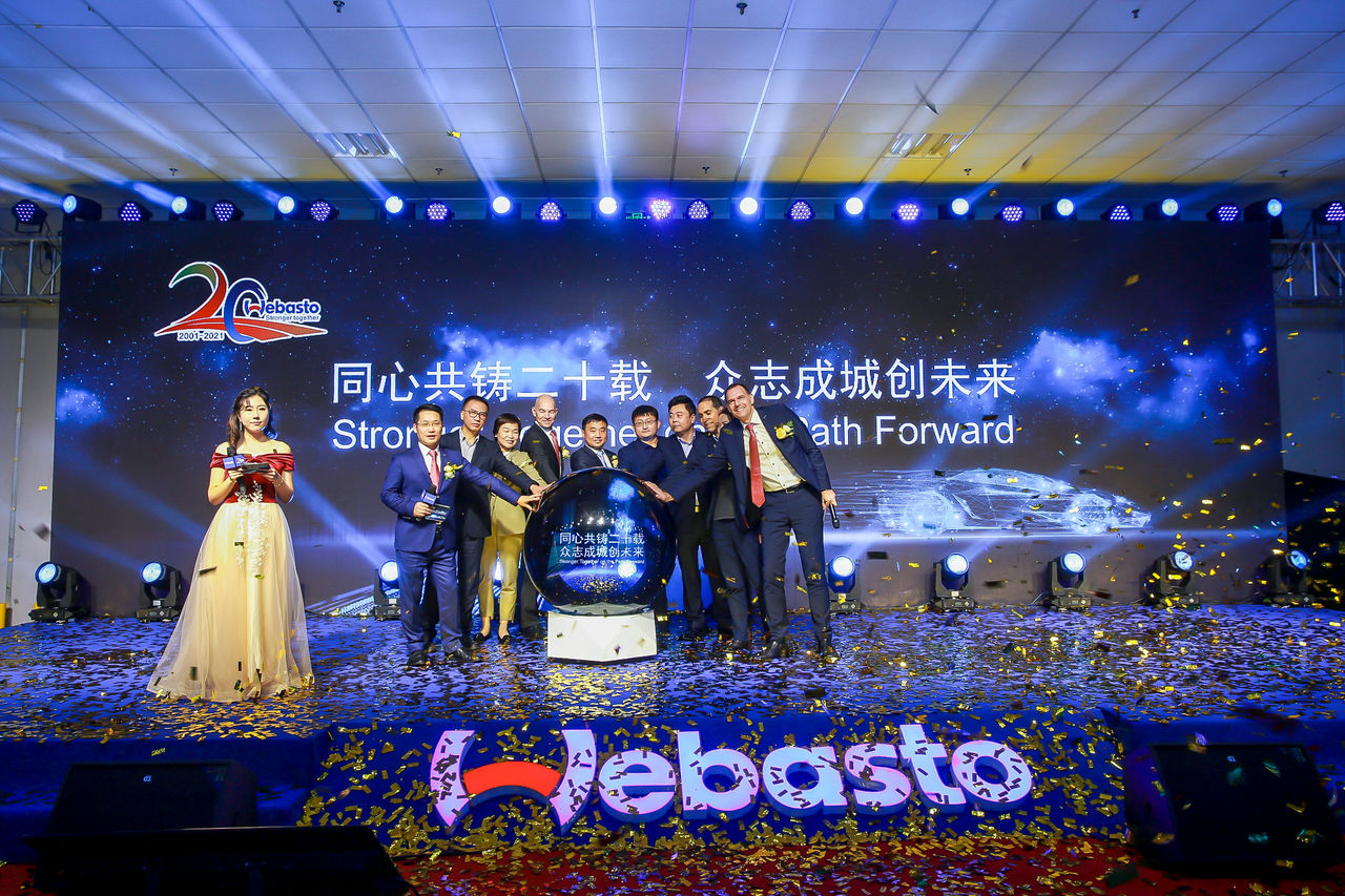 Webasto China 20th-anniversary onstage celebration with executives launching a strategic partnership initiative, highlighting Webasto as a global system partner.