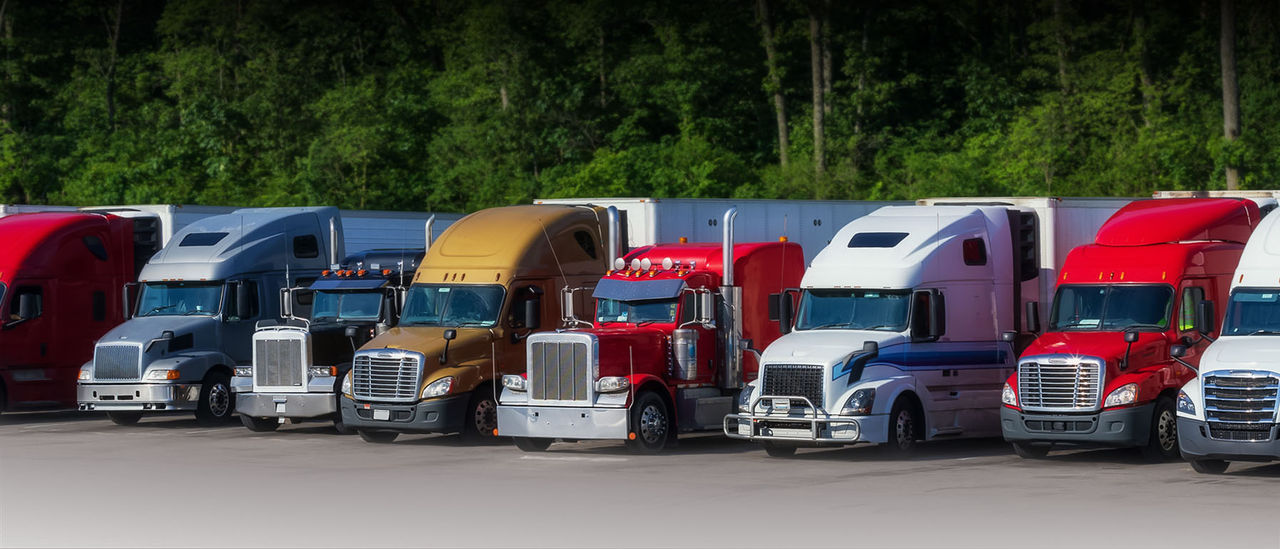 Class 8 sleeper-cab tractors in depot, representing commercial truck platforms for Webasto as system partner in thermal & electrification solutions.